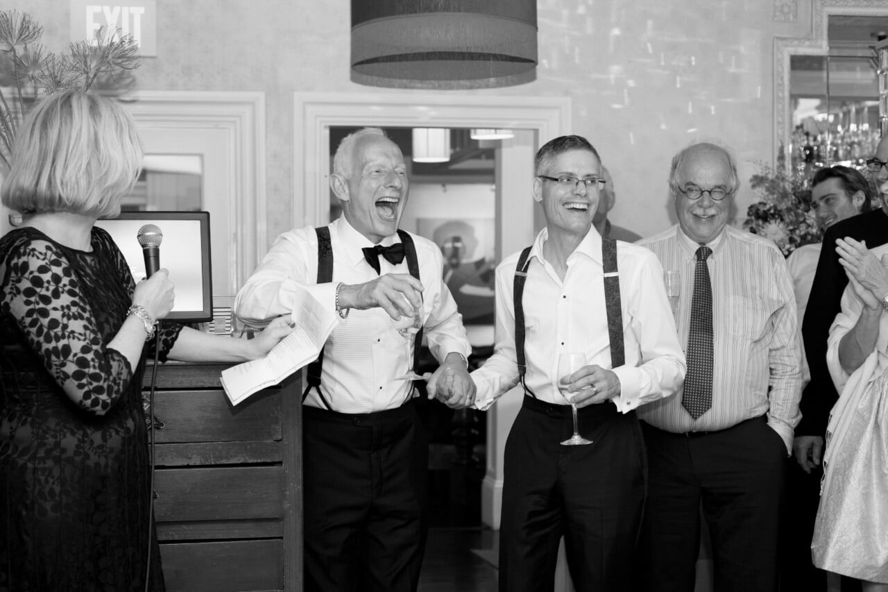 Grooms laughing - Same sex wedding reception at Natalie's Camden Harbor Inn