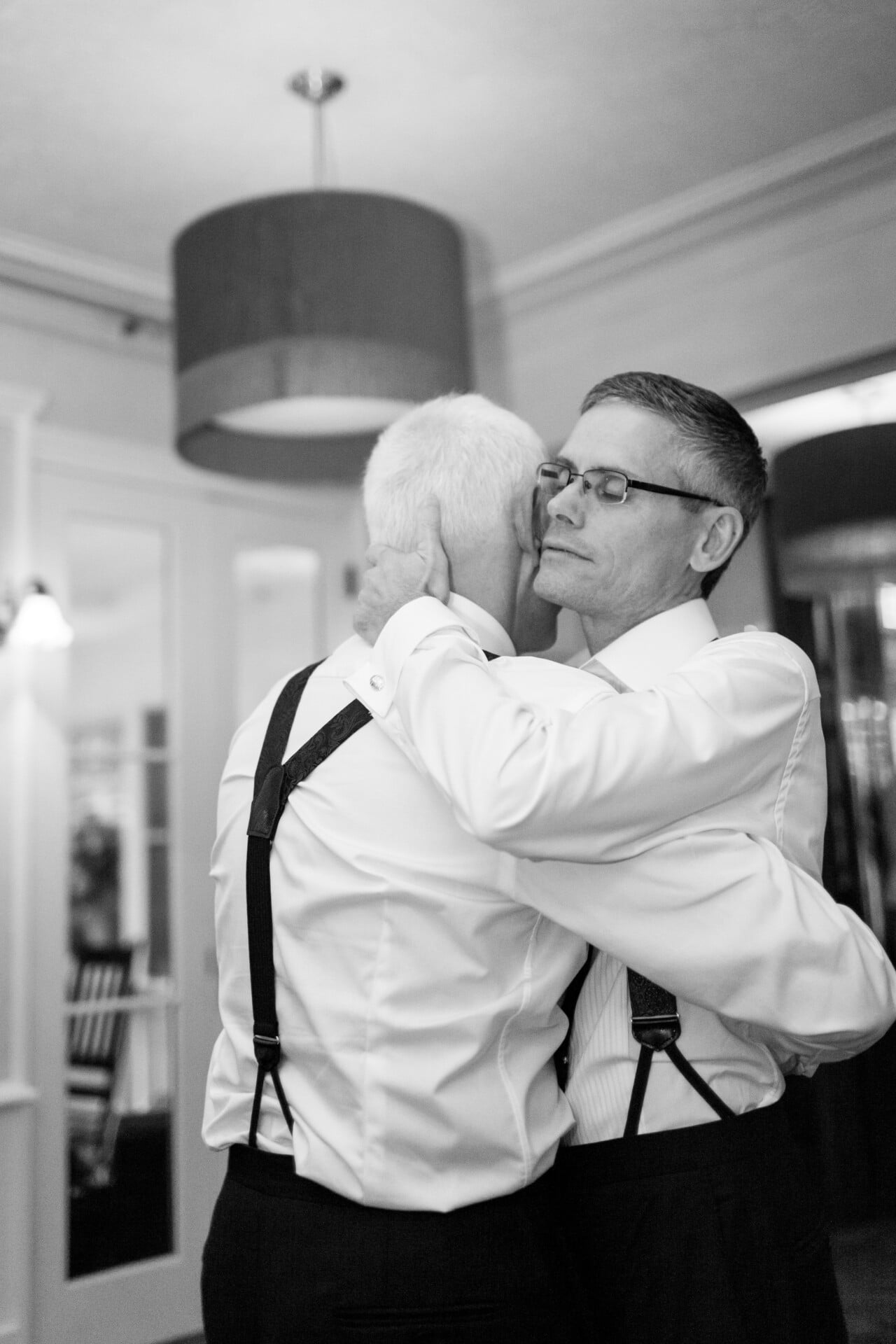 Grooms dancing at wedding reception