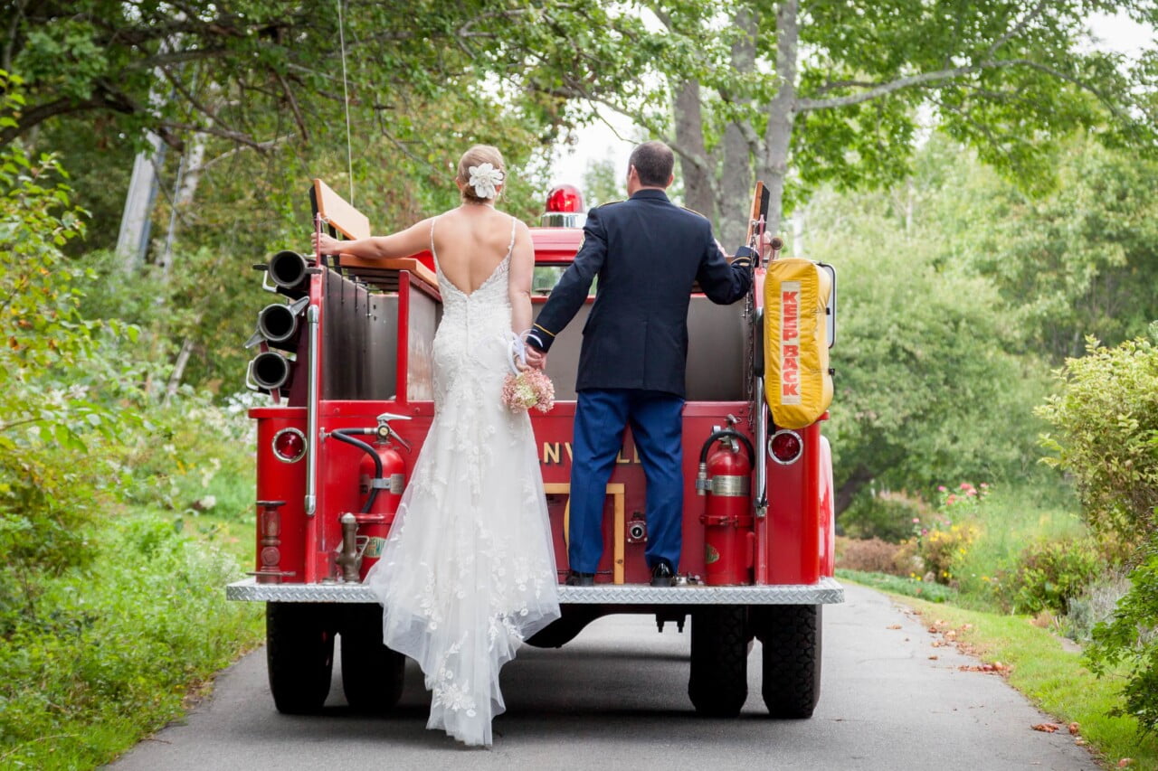 Bride and groom on back of Lincolnville Maine fire truck