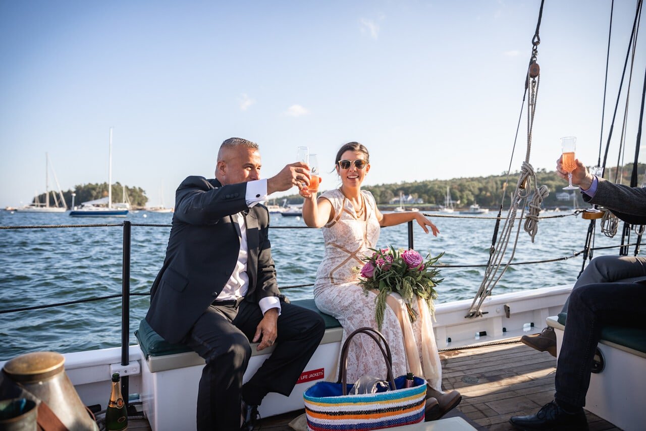 Camden Maine Wedding - Schooner Surprise - Bride and Groom toast © 5iveLeaf Photography
